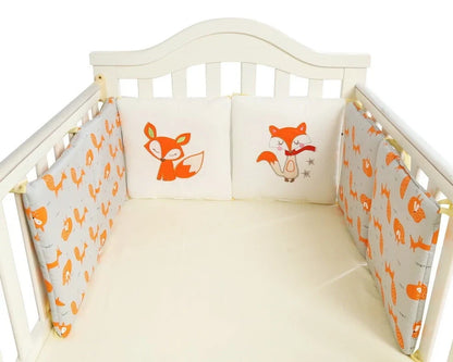 Six 30cm square cotton baby bedding panels with animal patterns surrounding white cot