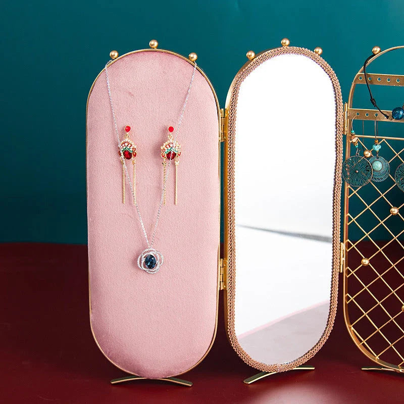 Foldable jewelry display stand with flannel-lined interior and iron frame, showcasing earrings, necklaces, and other accessories