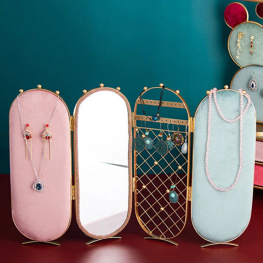 Foldable jewelry display stand with flannel-lined interior and iron frame, showcasing earrings, necklaces, and other accessories