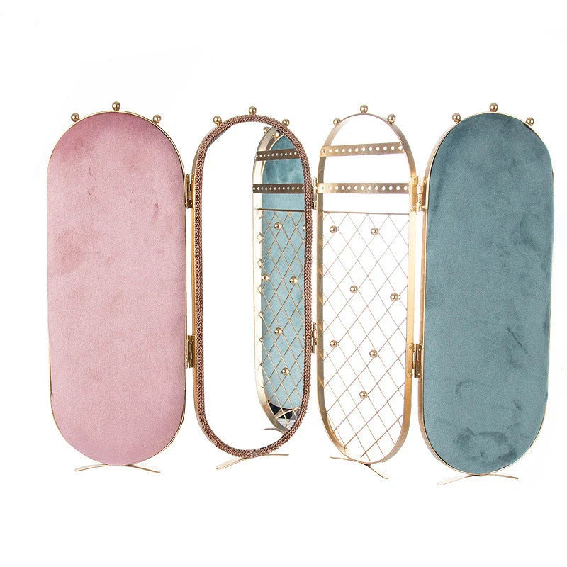 Foldable jewelry display stand with flannel-lined interior and iron frame, showcasing earrings, necklaces, and other accessories