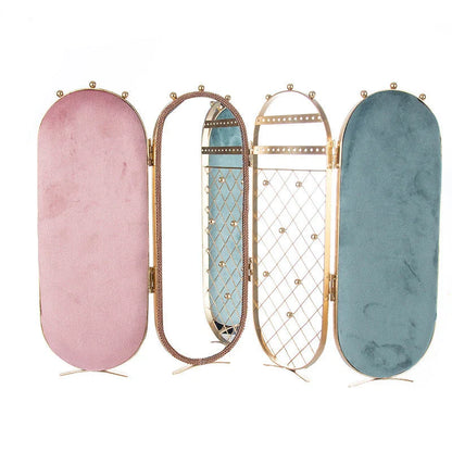 Foldable jewelry display stand with flannel-lined interior and iron frame, showcasing earrings, necklaces, and other accessories