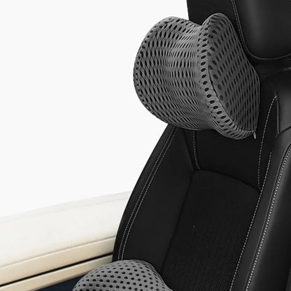 Memory foam car headrest and lumbar support set with polyurethane cover and solid colour stitching in blue, green, grey or black.