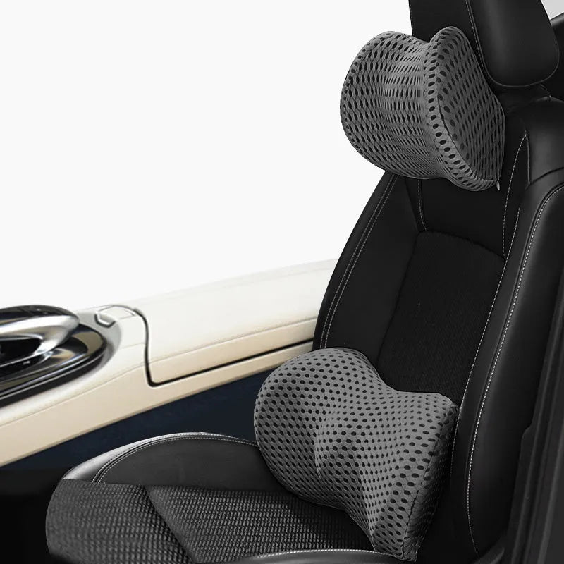 Memory foam car headrest and lumbar support set with polyurethane cover and solid colour stitching in blue, green, grey or black.