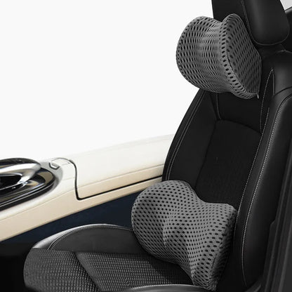 Memory foam car headrest and lumbar support set with polyurethane cover and solid colour stitching in blue, green, grey or black.