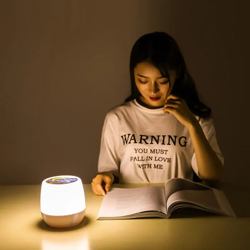 Pruixin PRX1363 projector night light showing rotating star patterns on a wall in a bedroom setting