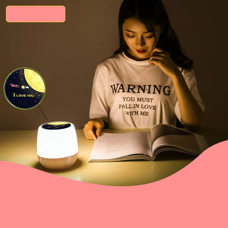 Pruixin PRX1363 projector night light showing rotating star patterns on a wall in a bedroom setting