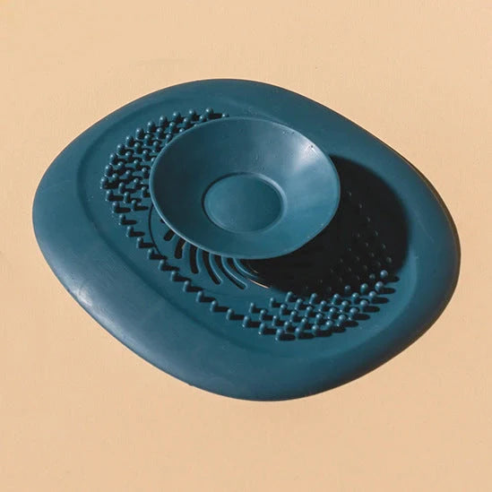 TPR vortex design sink drain cover in twilight orange, quiet blue, mango yellow, and gentian green