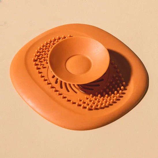 TPR vortex design sink drain cover in twilight orange, quiet blue, mango yellow, and gentian green