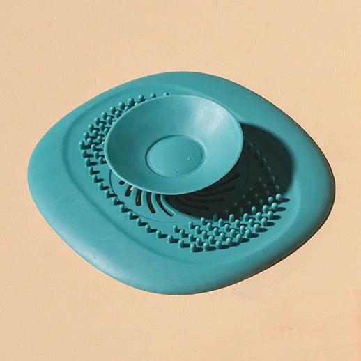 TPR vortex design sink drain cover in twilight orange, quiet blue, mango yellow, and gentian green