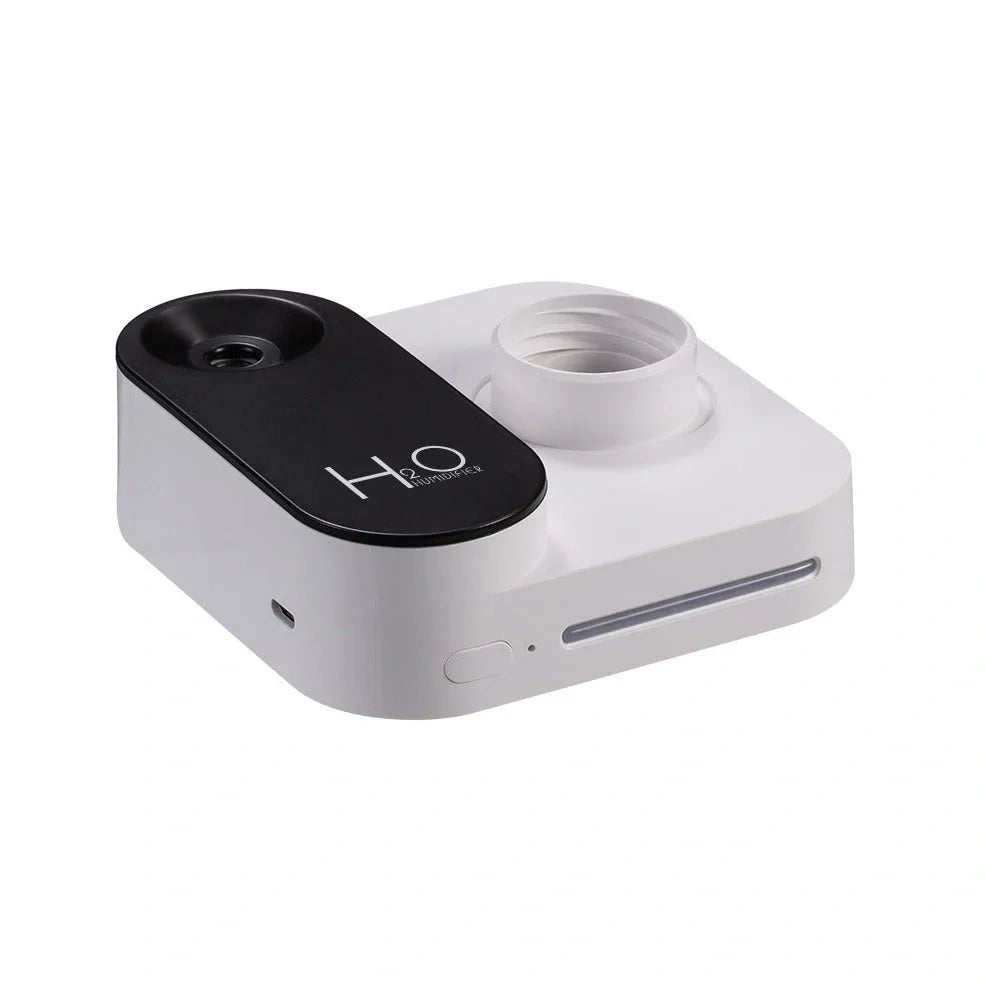 Green mineral water bottle style USB humidifier measuring 100mm with single mist outlet