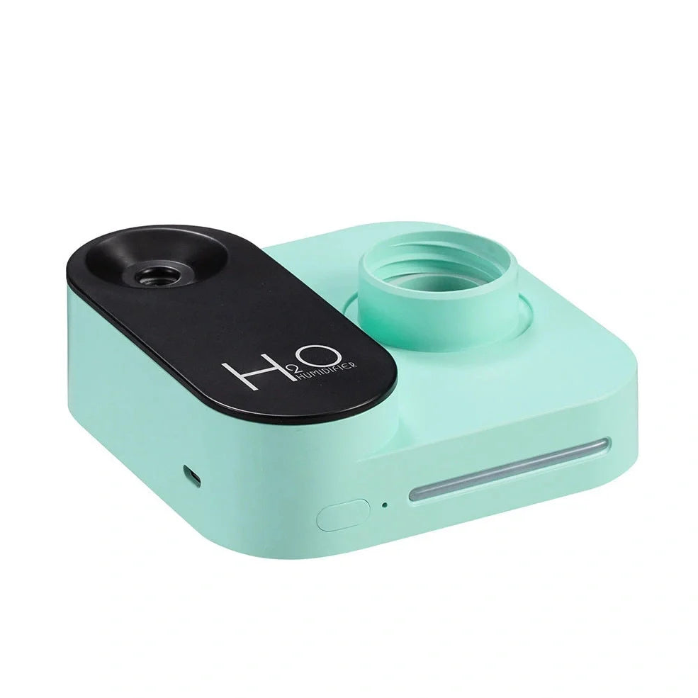 Green mineral water bottle style USB humidifier measuring 100mm with single mist outlet