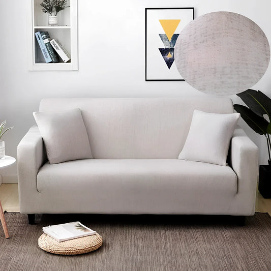 Geometric pattern sofa slipcover stretched over three-seater sofa in beige colour