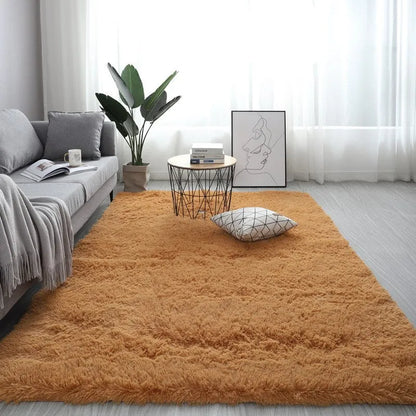 Rectangular plush carpet in solid colour with fluffy texture on hardwood floor