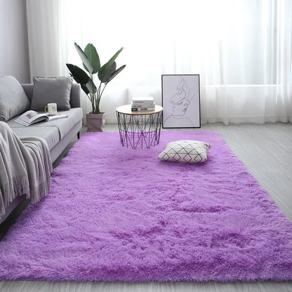 Rectangular plush carpet in solid colour with fluffy texture on hardwood floor