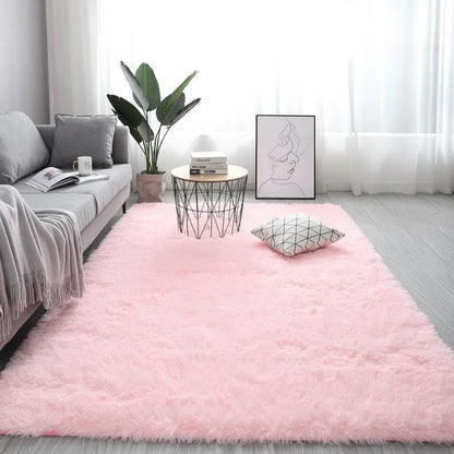 Rectangular plush carpet in solid colour with fluffy texture on hardwood floor