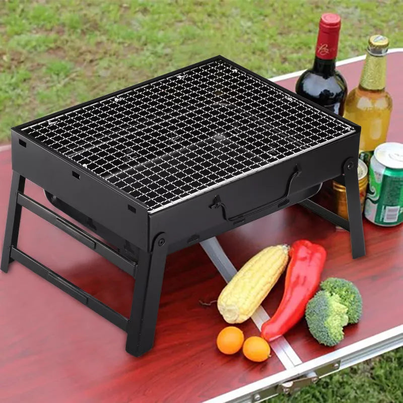 Portable folding charcoal barbecue grill with 35x27 cm cooking area