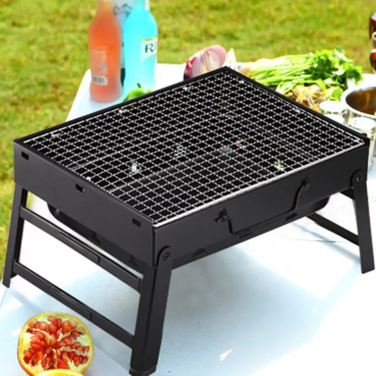Portable folding charcoal barbecue grill with 35x27 cm cooking area