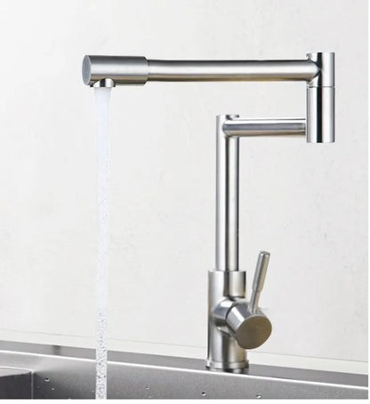 Silver stainless steel kitchen faucet with a single lever and 360-degree rotating spout on a sink.