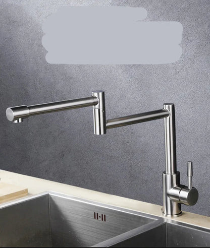 Silver stainless steel kitchen faucet with a single lever and 360-degree rotating spout on a sink.