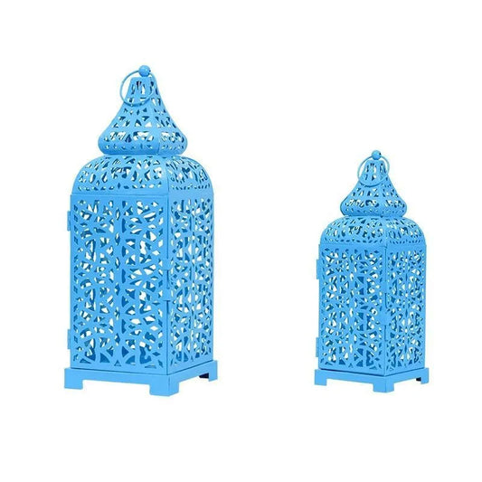 Hollow iron candlestick with geometric design measuring 38cm tall with 14cm square base