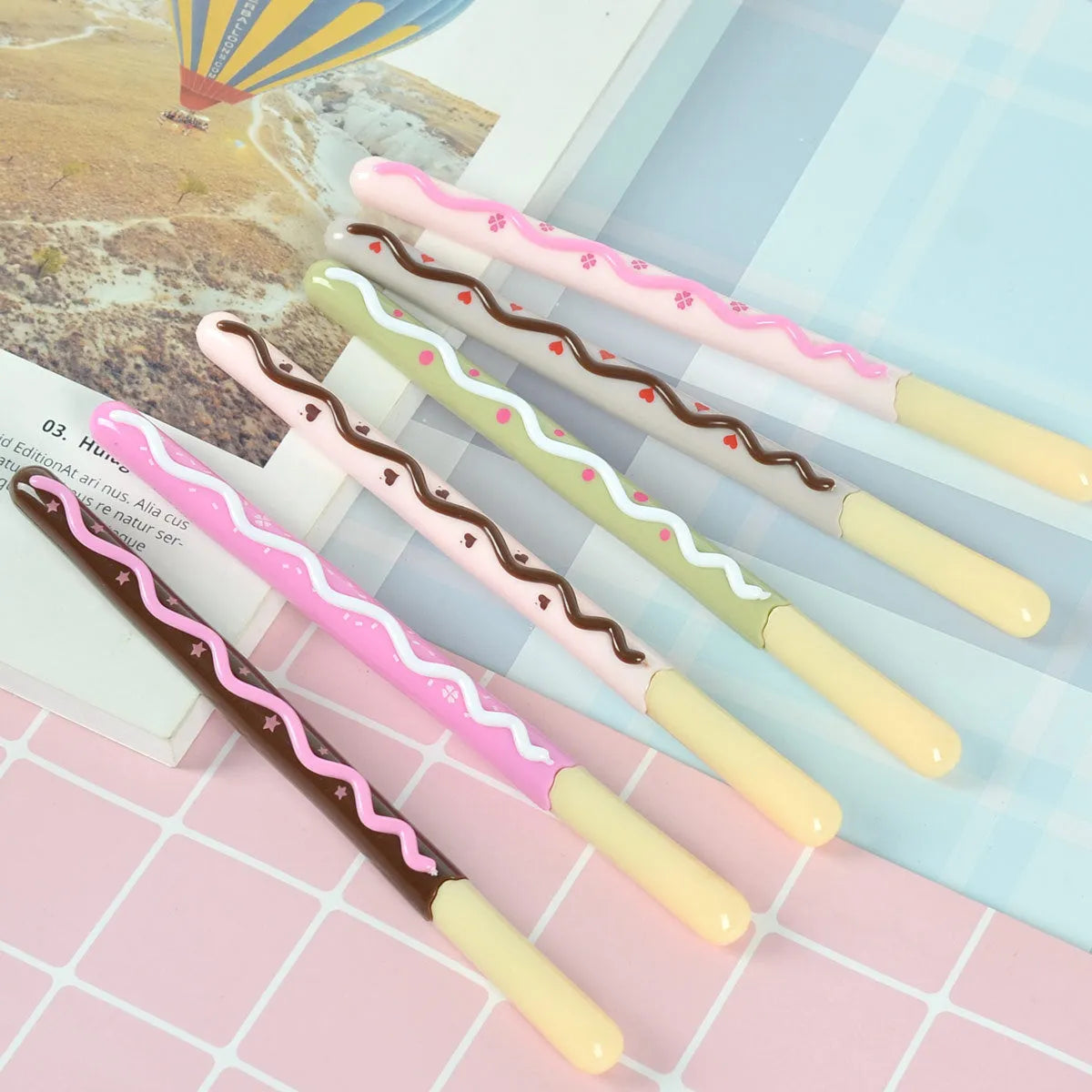 Set of five scented soft gelatin chocolate bar themed gel pens with 0.5mm needle tips.