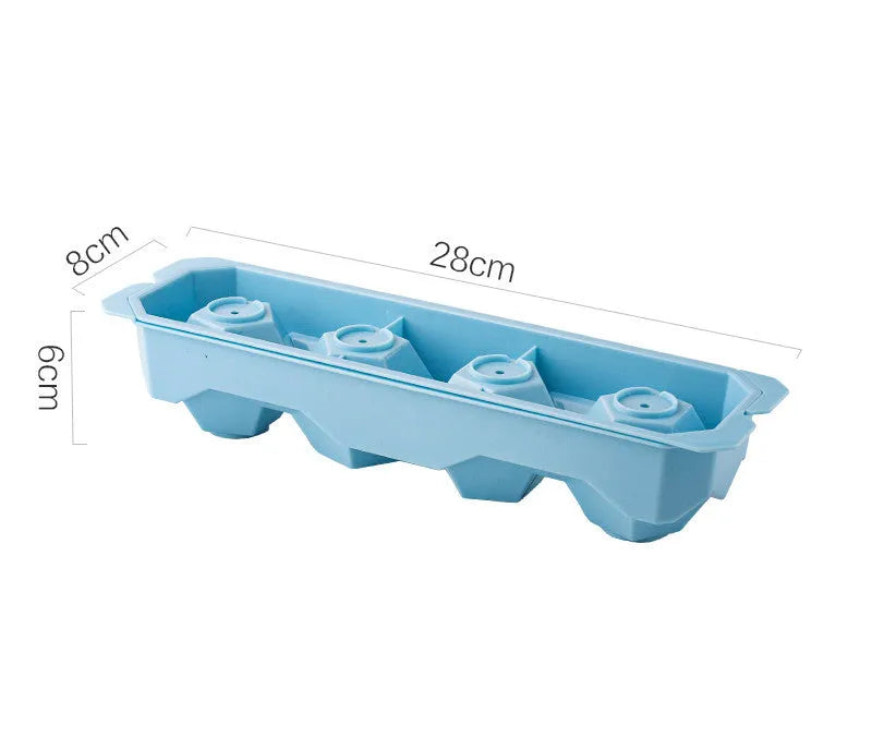 Silicone ice tray in various colours making large ice cubes, including hockey puck and geometric shapes, on a kitchen counter