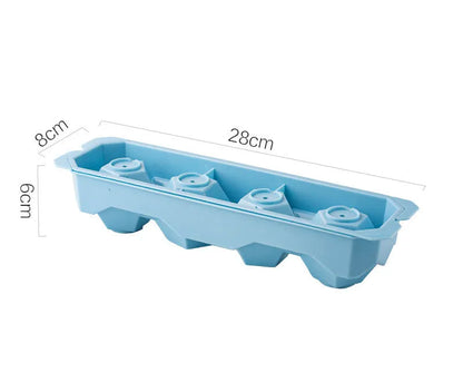 Silicone ice tray in various colours making large ice cubes, including hockey puck and geometric shapes, on a kitchen counter