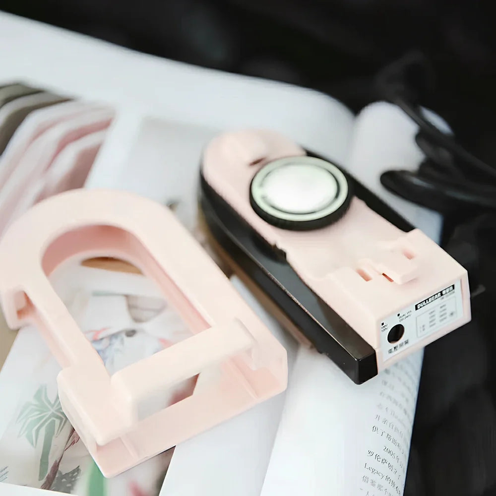 Compact white or pink 220V electric iron, 20cm long, for home clothing wrinkle removal