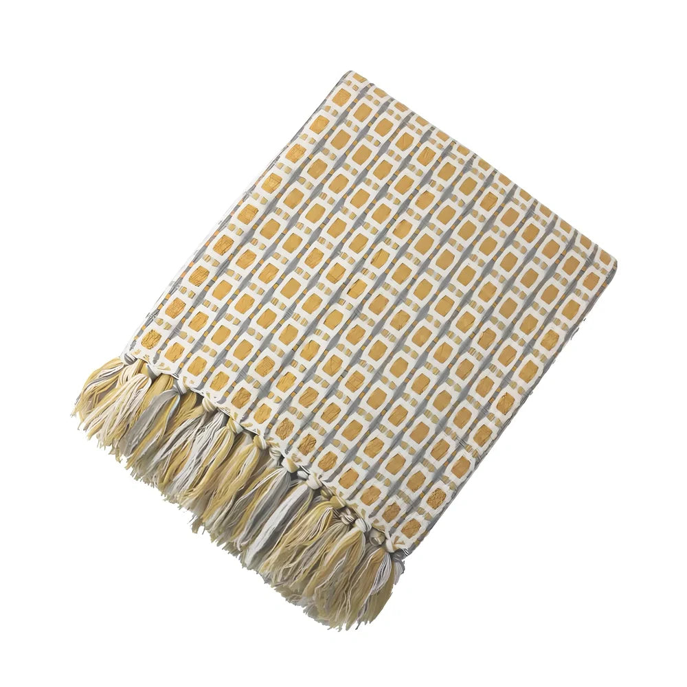 Yellow geometric pattern blanket measuring 130cm by 152cm with tassel edges