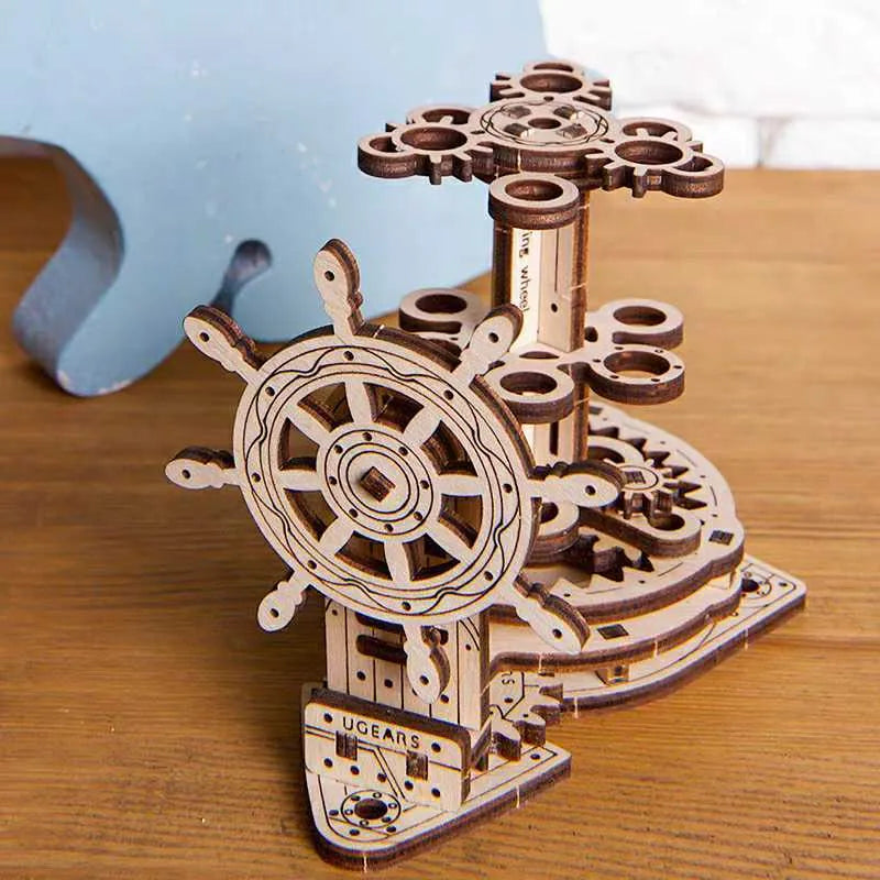 Ukrainian wooden rotating pen holder with steering wheel design on desk