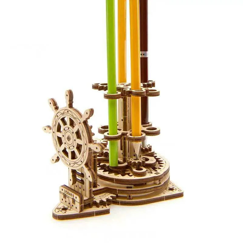 Ukrainian wooden rotating pen holder with steering wheel design on desk