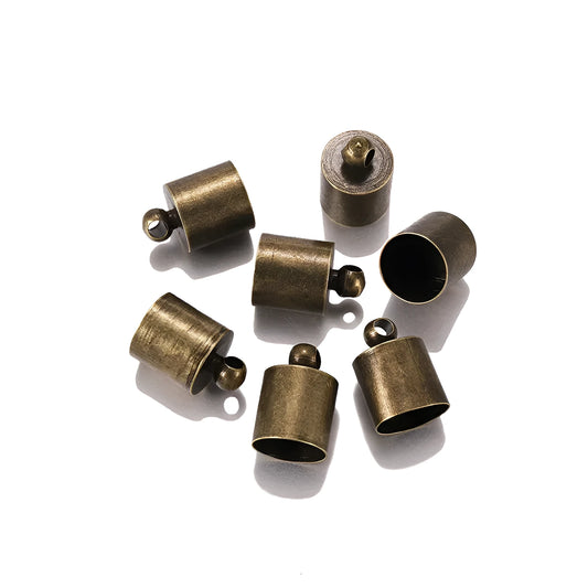 Assorted copper weight caps in gold, silver, and bronze electroplated finishes, shown in different sizes for jewellery making.