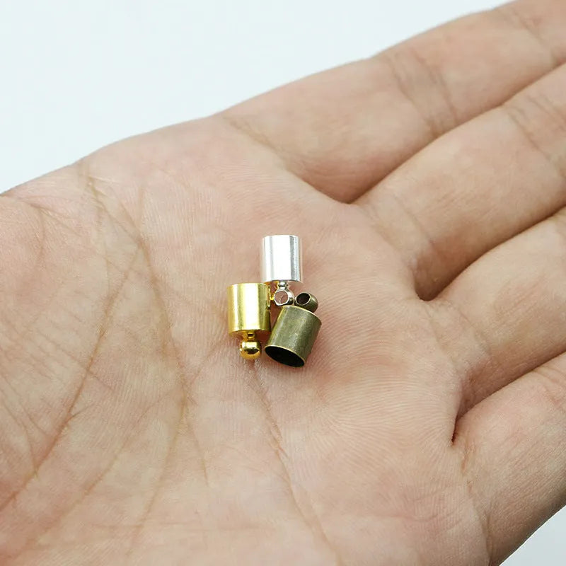 Assorted copper weight caps in gold, silver, and bronze electroplated finishes, shown in different sizes for jewellery making.