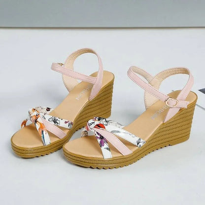 Women's pink wedge sandals with fish mouth design, non-slip PU soles, and adjustable buckle closure.