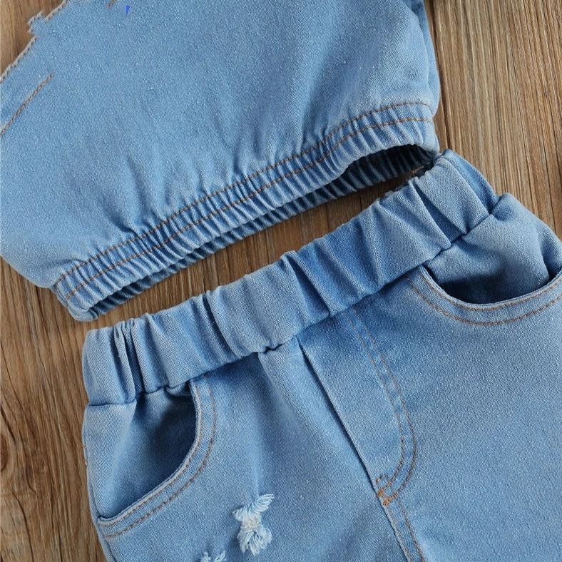 Girls' sky blue two-piece dress set with matching shorts, size chart showing measurements for ages 6 months to 5 years