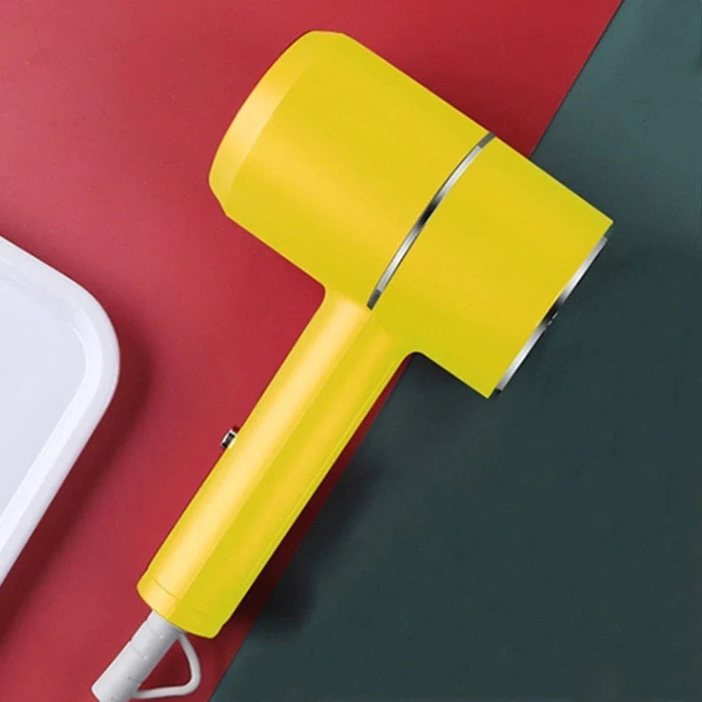 Compact black negative ion hair dryer showing 18cm length with four speed buttons and hot/cold air switch