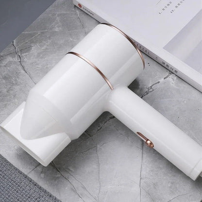 Compact black negative ion hair dryer showing 18cm length with four speed buttons and hot/cold air switch