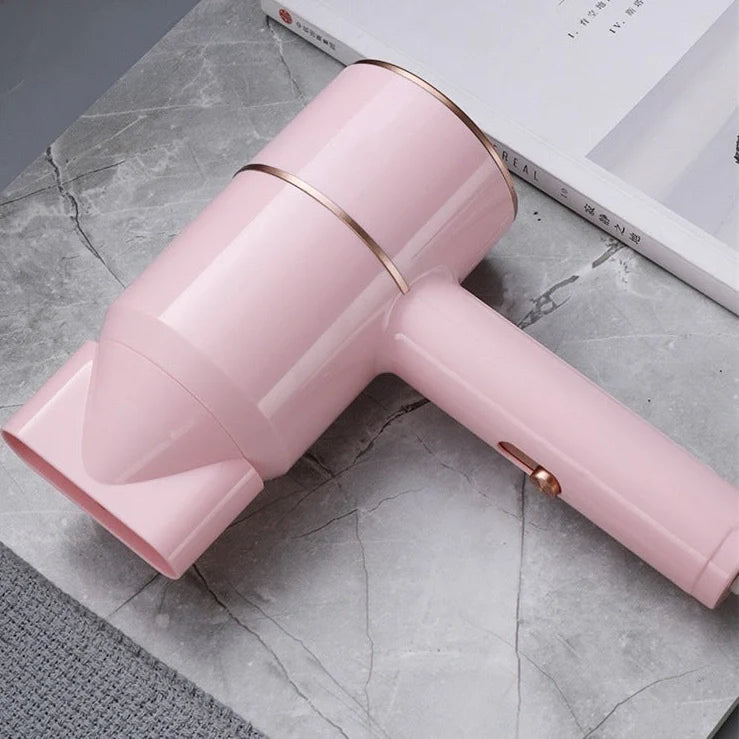 Compact black negative ion hair dryer showing 18cm length with four speed buttons and hot/cold air switch