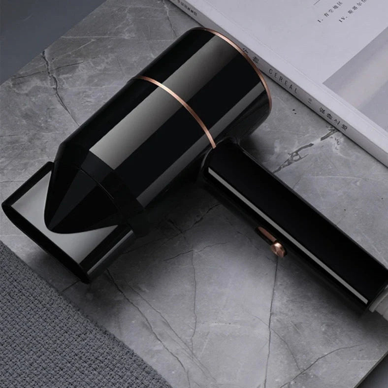 Compact black negative ion hair dryer showing 18cm length with four speed buttons and hot/cold air switch