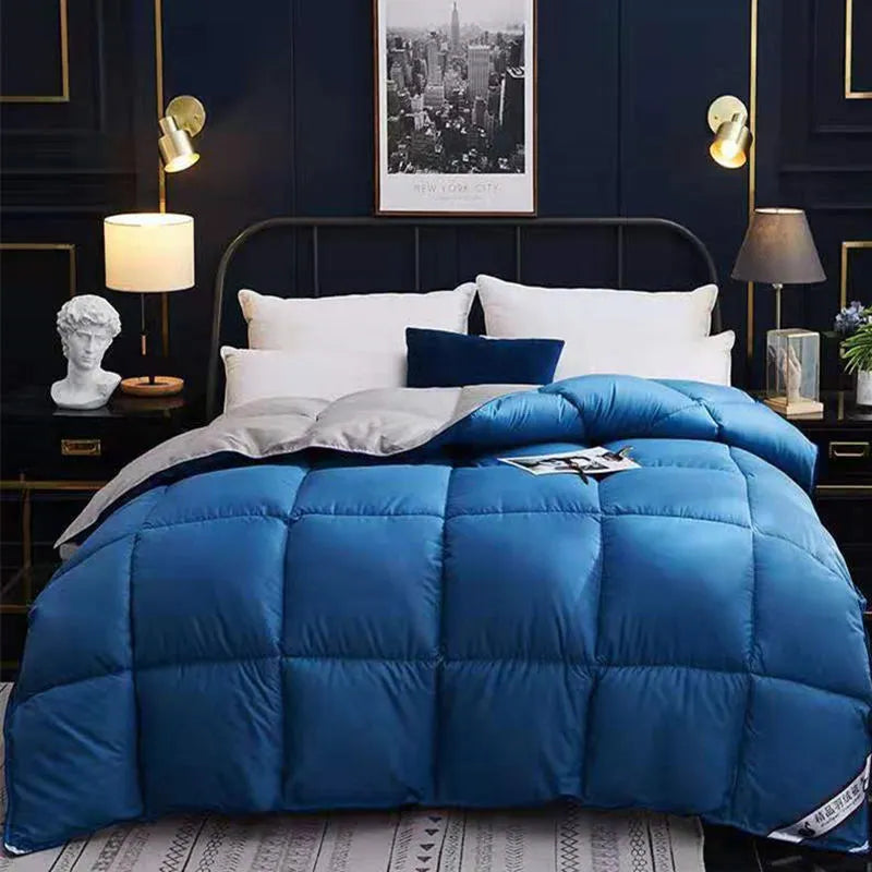 Goose down winter duvet in twill fabric showing colour options on a bed