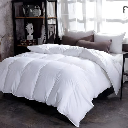 Goose down winter duvet in twill fabric showing colour options on a bed