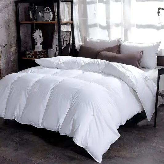 Goose down winter duvet in twill fabric showing colour options on a bed