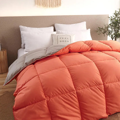 Goose down winter duvet in twill fabric showing colour options on a bed