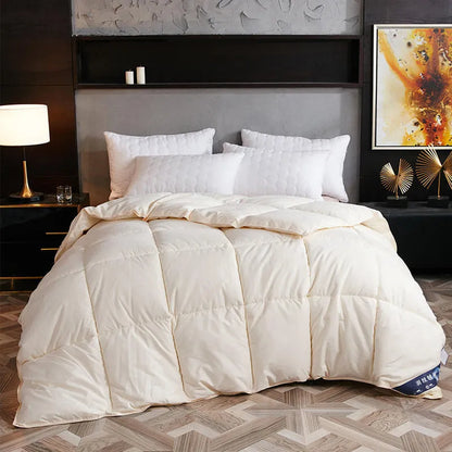 Goose down winter duvet in twill fabric showing colour options on a bed