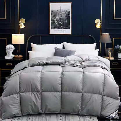 Goose down winter duvet in twill fabric showing colour options on a bed
