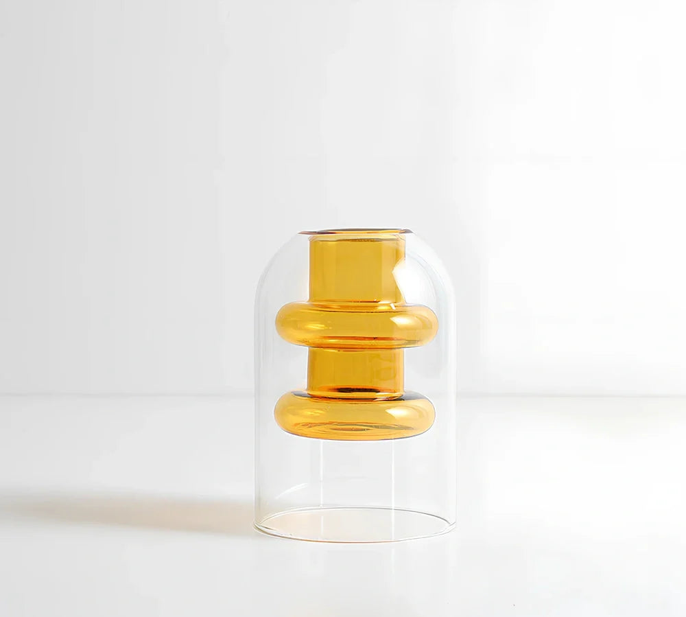 Transparent glass vase with colourful inner layer displaying dried flowers, 15cm tall on wooden table