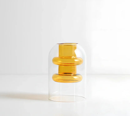 Transparent glass vase with colourful inner layer displaying dried flowers, 15cm tall on wooden table