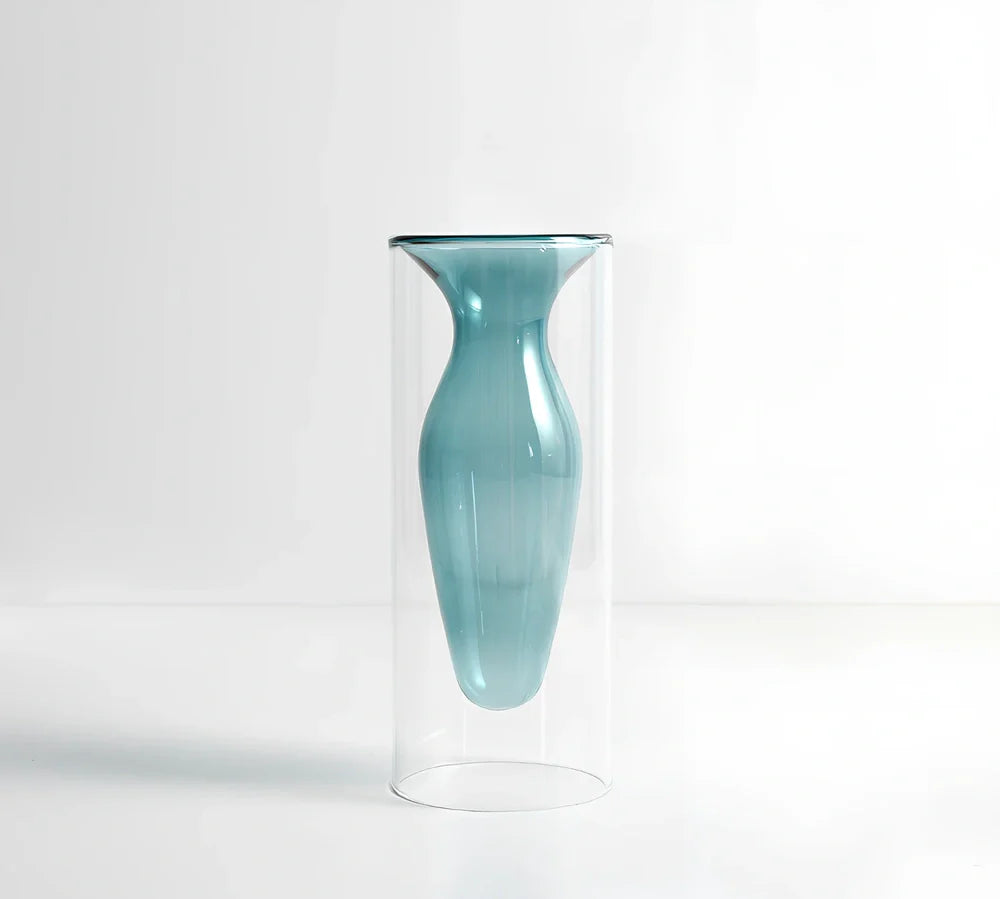 Transparent glass vase with colourful inner layer displaying dried flowers, 15cm tall on wooden table