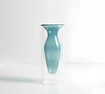 Transparent glass vase with colourful inner layer displaying dried flowers, 15cm tall on wooden table