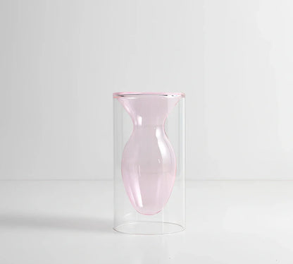 Transparent glass vase with colourful inner layer displaying dried flowers, 15cm tall on wooden table